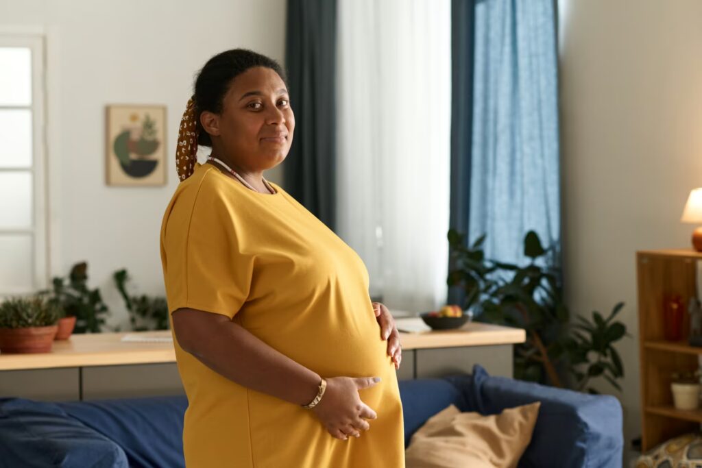 Pre & Postnatal Women 1 pregnant woman standing in the room 2023 12 15 00 22 37 utc