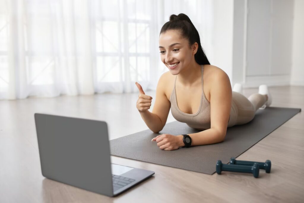 Online Physio 9 woman enjoying online fitness class home interior 2023 11 27 05 35 14 utc
